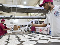 Vendors are preparing Qatayef, traditional pancakes that are popular during the Muslim fasting month of Ramadan, in Doha, Qatar, on March 12...