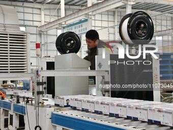 A worker is operating equipment in a digital intelligent production workshop at a hardware manufacturing company in Handan, North China's He...