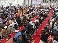 Muslim devotees are sitting together before breaking their fast during the Holy month of Ramadan at Baitul Mukarram National Mosque in Dhaka...