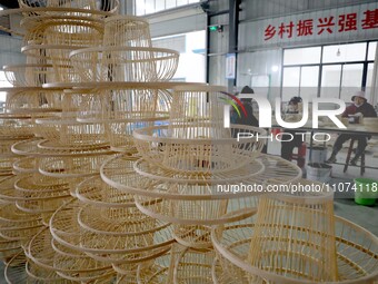 Workers are working on a production line in a craft company's workshop in Liuzhou, China, on March 10, 2024. (