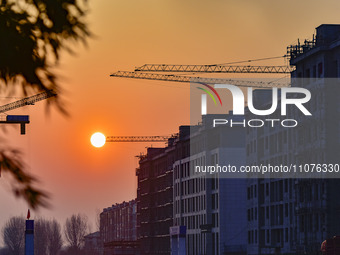 A commercial housing complex is under construction in Qingzhou, China, on March 15, 2024. (