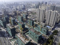 A commercial housing complex is under construction and for sale in downtown Huai'an, East China's Jiangsu province, on March 15, 2024. (