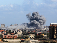 Smoke is rising over buildings in north Gaza amid the ongoing conflict between Israel and the Palestinian Islamist group Hamas, as seen from...