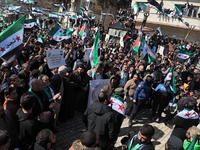 Syrians mark the 13th anniversary of the uprising against the Bashar al-Assad regime in the rebel-held city of Azaz, northwestern Syria, Mar...