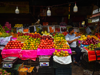 A fruit seller is waiting for his customers inside a wholesale market during Ramadan in Kolkata, India, on March 17, 2023. (