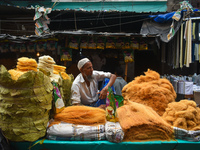 A person is selling simai (sweet food items) during Ramadan in Kolkata, India, on March 17, 2023. (