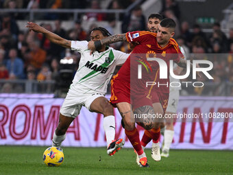 Armand Lauriente of U.S. Sassuolo and Gianluca Mancini of A.S. Roma are competing during the 29th day of the Serie A Championship between A....