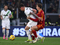 Andrea Pinamonti of U.S. Sassuolo and Diego Llorente of A.S. Roma are competing during the 29th day of the Serie A Championship between A.S....