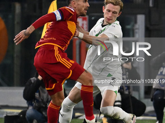 Lorenzo Pellegrini of A.S. Roma is competing against Marcus Holmgren Pedersen of U.S. Sassuolo during the 29th day of the Serie A Championsh...