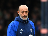 Nuno Espirito Santo, the head coach of Nottingham Forest, is watching the Premier League match between Luton Town and Nottingham Forest at K...