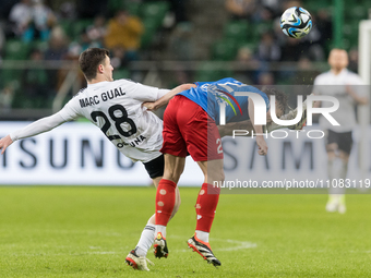 Mark Gual and Ariel Mosor are playing during the Legia Warsaw vs Piast Gliwice PKO Ekstraklasa match in Warsaw, Poland, on March 17, 2024. (