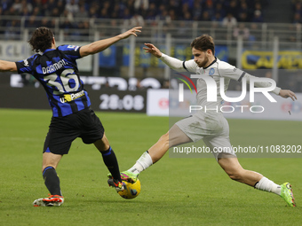 Khvicha Kvaratskhelia of Napoli is being challenged by Matteo Darmian of Inter during the Serie A soccer match between Inter FC and SSC Napo...