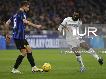 Frank Zambo Anguissa of Napoli and Francesco Acerbi of Inter are competing during the Serie A soccer match between Inter FC and SSC Napoli a...