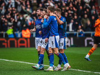 Oldham Athletic players are celebrating James Norwood's penalty during the Vanarama National League match between Oldham Athletic and Cheste...