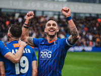 Liam Hogan of Oldham Athletic is celebrating after his team scores their second goal in the Vanarama National League match against Chesterfi...