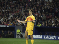 Barcelona's Spanish forward Joao Felix is playing during the La Liga soccer match between Atletico Madrid and Barcelona at the Metropolitano...