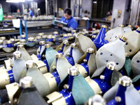 A worker is producing foreign trade products on a workshop production line at a spandex company in the Lianyungang Economic and Technologica...