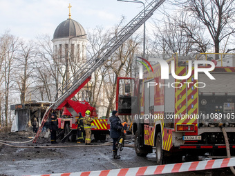 Firefighters are eliminating the consequences of Russian shelling in the Shevchenkivskyi district of Kyiv, Ukraine, on March 21, 2024. (