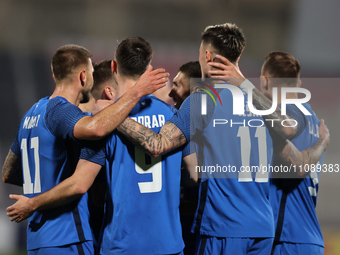 Andraz Sporar, second from the left, of Slovenia is celebrating with his teammates after scoring the first goal, making it 0-1, during the f...