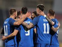 Andraz Sporar, second from the left, of Slovenia is celebrating with his teammates after scoring the first goal, making it 0-1, during the f...