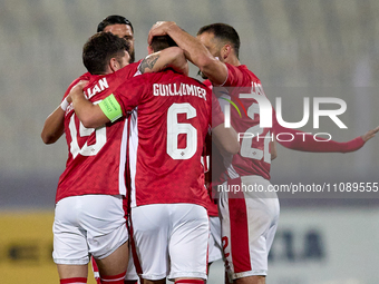 Matthew Guillaumier (center) is being congratulated by his teammates after scoring the equalizing goal to make it 1-1 during the friendly in...