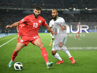 Shihab Qumbor (L) of Palestine is in action against Isa Faysal of Bangladesh during the FIFA World Cup 2026 and the AFC Asian Cup Saudi Arab...