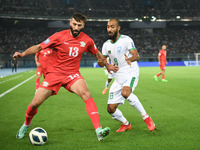Shihab Qumbor (L) of Palestine is in action against Isa Faysal of Bangladesh during the FIFA World Cup 2026 and the AFC Asian Cup Saudi Arab...