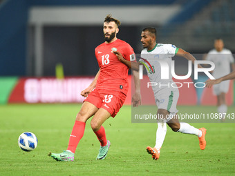 Shihab Qumbor (L) of Palestine is in action against Md Rahman Jony of Bangladesh during the FIFA World Cup 2026 and the AFC Asian Cup Saudi...