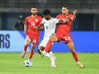 Mahmoud Eid (R) of Palestine is in action against Isa Faysal of Bangladesh during the FIFA World Cup 2026 and the AFC Asian Cup Saudi Arabia...