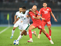 Mohammed Rashid (R) of Palestine is in action against Isa Faysal of Bangladesh during the FIFA World Cup 2026 and the AFC Asian Cup Saudi Ar...