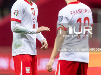 Robert Lewandowski and Przemyslaw Frankowski are playing during the UEFA EURO 2024 qualifier play-off between Poland and Estonia in Warsaw,...