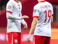 Robert Lewandowski and Przemyslaw Frankowski are playing during the UEFA EURO 2024 qualifier play-off between Poland and Estonia in Warsaw,...