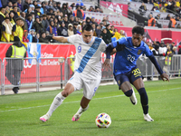 Rubio Rubin (9) is disputing the ball with Ecuador's Leo Realpe (20) in the friendly match between Guatemala and Ecuador at the Red Bull Are...