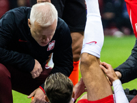 Matty Cash is getting injured during the UEFA Euro 2024 semi-final match between Poland and Estonia in Warsaw, Poland, on March 21, 2024. (