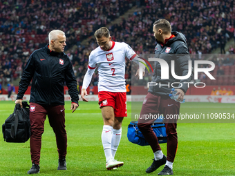 Matty Cash is getting injured during the UEFA Euro 2024 semi-final match between Poland and Estonia in Warsaw, Poland, on March 21, 2024. (
