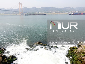 Purified water from the sewage treatment plant is meeting the standards and is being discharged into the Yangtze River in Yichang, Hubei, Ch...