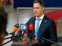 Belgium's Prime Minister Alexander De Croo is speaking to the press as he arrives to attend the European Council summit on the second day in...
