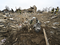 Rescuers are searching among the debris of houses destroyed by a massive missile strike by Russian troops in Zaporizhzhia, Ukraine, on March...