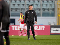 Assistant coach Davide Mandelli of the Malta national soccer team is overseeing the pre-match warm-up ahead of the friendly international so...