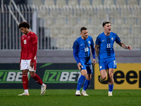 Benjamin Sesko (R) of Slovenia is celebrating after scoring the equalizing goal to make it 2-2 during the friendly international soccer matc...