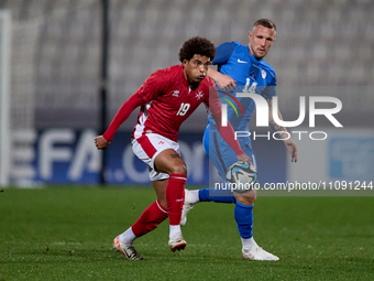 Yannick Yankam, a player for the Malta national soccer team, is in action during the friendly international soccer match against Slovenia at...
