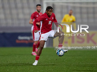 Paul Mbong of the Malta national soccer team is in action during the friendly international soccer match between Malta and Slovenia at the N...