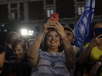 Xochitl Galvez, the presidential candidate for the Fuerza y Corazon por Mexico coalition, is taking a selfie with her supporters during a pr...