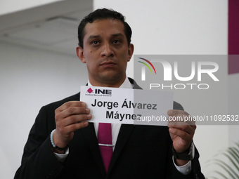 A hostess is showing the name of Jorge Alvarez Maynez during the electoral raffle at the Public Session of the Table of Representatives of t...