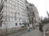 A residential building is being damaged by a rocket fragment during Russian shelling in Dnipro, Ukraine, on March 22, 2024. (