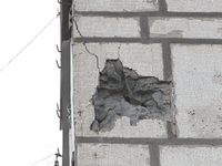 A rocket fragment is piercing the wall of a residential building during Russian shelling in Dnipro, Eastern Ukraine, on March 22, 2024. NO U...