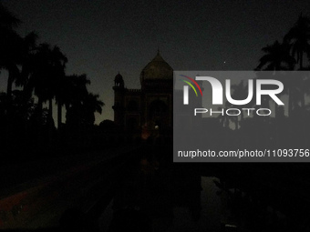 Safdarjung's Tomb is pictured with its lights turned off during the Earth Hour environmental campaign in New Delhi, India, on March 23, 2024...