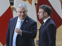 Emmanuel Macron President of France and Viktor Orban Prime Minister of Hungary are talking while they attend a family photo for the 30th ann...