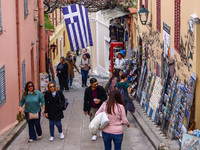 Tourist visiting Plaka, an old historical neighborhood in Athens, Greece on March 16th, 2024.  (