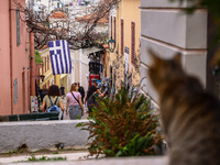 Tourist visiting Plaka, an old historical neighborhood in Athens, Greece on March 16th, 2024.  (